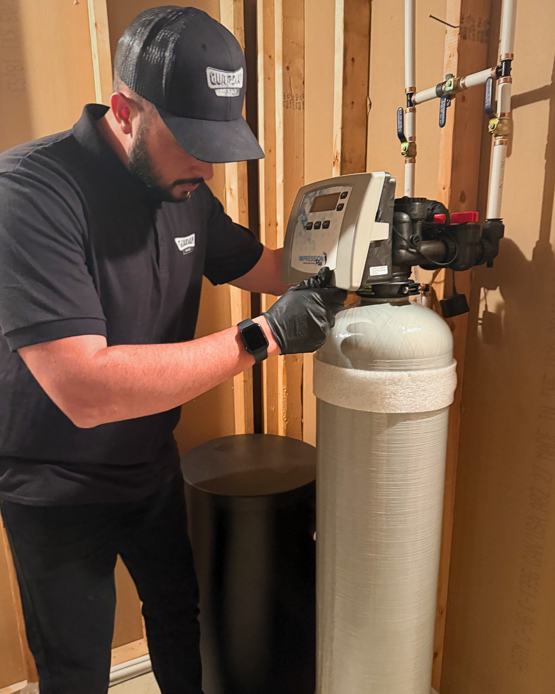David Delahunty installing a Guardian Water filtration system